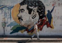 Venezuela crisis más desatendida - mural de Maduro